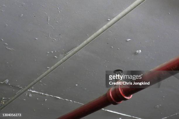 fire sprinkler on red pipe near ceiling - fire sprinkler stock pictures, royalty-free photos & images