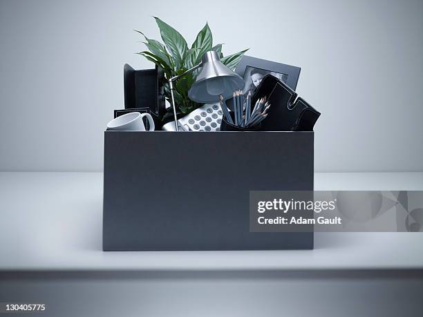 box packed with desk objects - being fired stock pictures, royalty-free photos & images