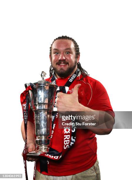 Wales player Adam Jones celebrates with the 6 Nations Trophy after the RBS Six Nations Championship match between Wales and France at the Millennium...