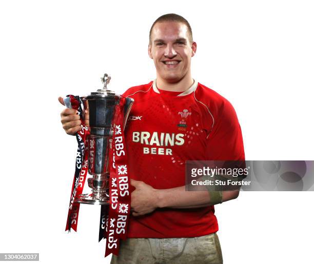 Wales player Gethin Jenkins celebrates with the 6 Nations Trophy after the RBS Six Nations Championship match between Wales and France at the...