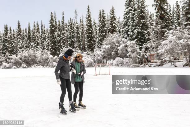 learning to ice-skate on a frozen lake - ice skate ストックフォトと画像