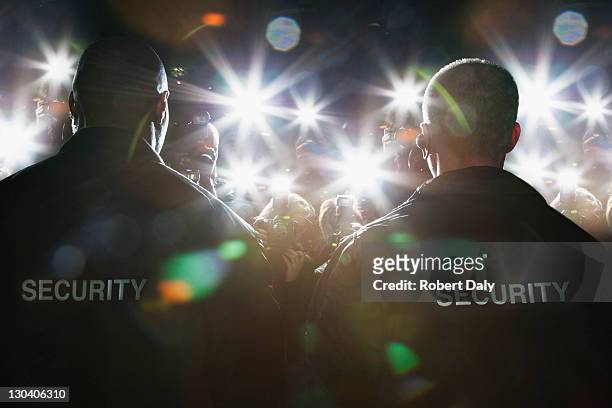security guards blocking paparazzi - protection stock pictures, royalty-free photos & images