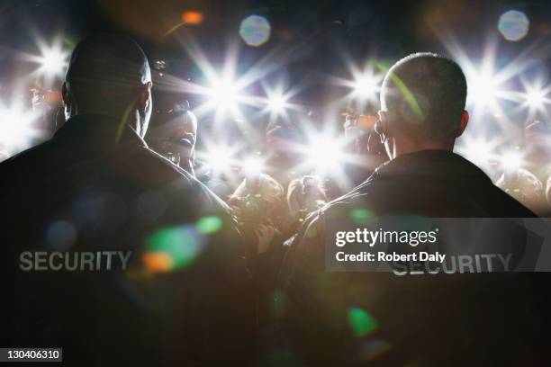 security guards blocking paparazzi - celebrity event stock pictures, royalty-free photos & images