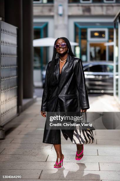 Lois Opoku is seen wearing black blazer Na-kd, Mango cropped pants, pink Asos heels, Bottega Veneta sunglasses, Ferragamo two tone black white bag on...