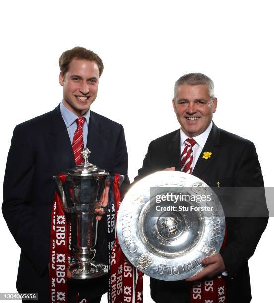 Prince William, Duke of Cambridge with the Six Nations Trophy and Wales head coach Warren Gatland pictured with the Triple Crown after the RBS 6...