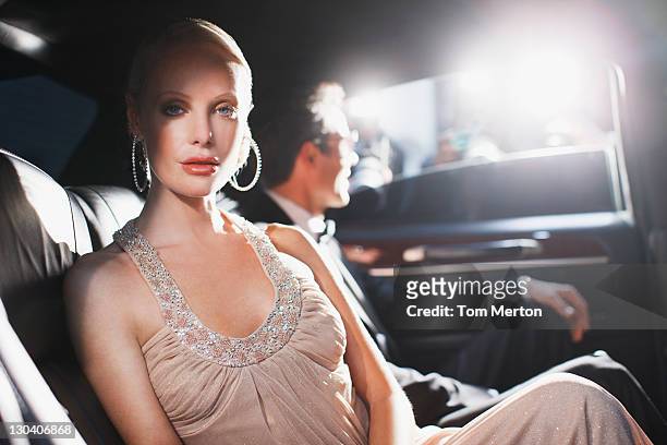 celebrity sitting in backseat of car - evening gown stock pictures, royalty-free photos & images