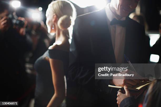 celebrity signing autographs on red carpet - celebrity stock pictures, royalty-free photos & images