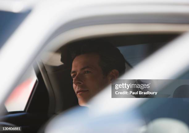 politician sitting in backseat of car - audi man stockfoto's en -beelden