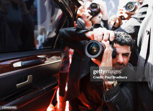 paparazzi taking pictures of celebrity in car - red carpet paparazzi stock pictures, royalty-free photos & images