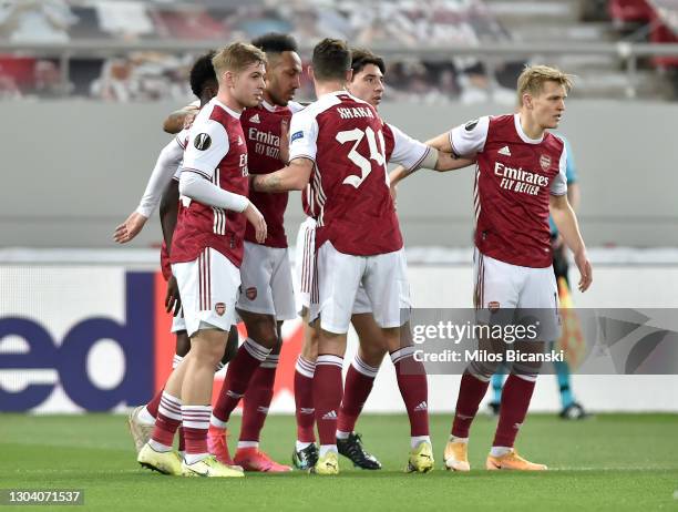 Pierre-Emerick Aubameyang of Arsenal celebrates with teammates Bukayo Saka, Emile Smith Rowe, Granit Xhaka, Hector Bellerin and Martin Odegaard after...