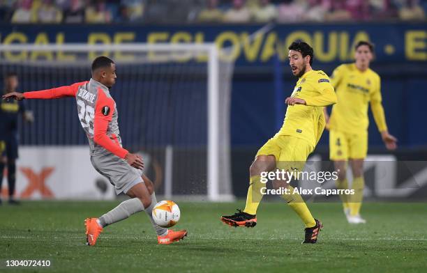 Daniel Parejo of Villarreal battles for possession with Antoine Bernede of Red Bull Salzburg during the UEFA Europa League Round of 32 match between...