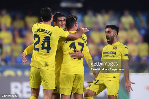 Gerard Moreno of Villarreal celebrates after scoring their team's first goal with his team during the UEFA Europa League Round of 32 match between...