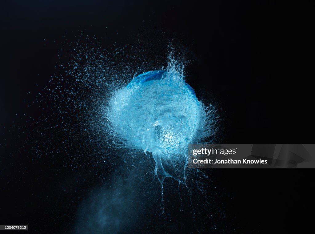 Exploding blue water balloon