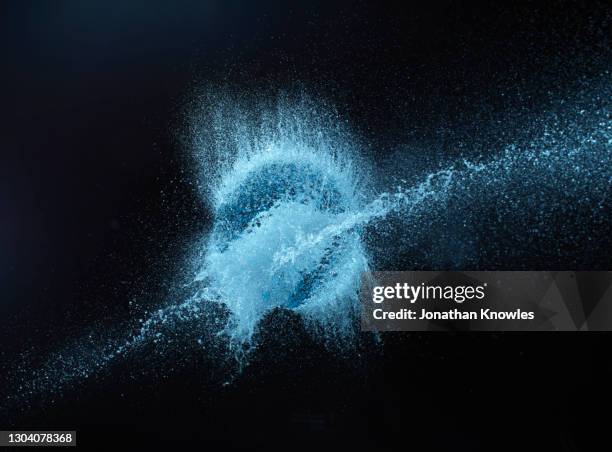 blue water explosion - splashing droplet stock pictures, royalty-free photos & images