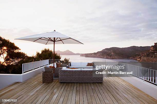 patio furniture on modern deck - solskärm bildbanksfoton och bilder