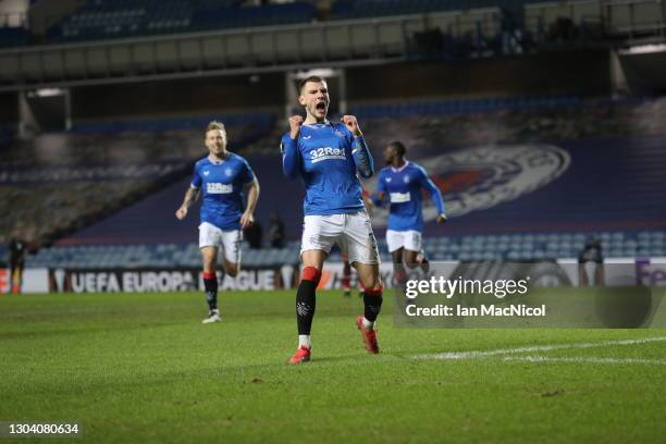 Borna Barisic of Rangers celebrates after scoring their team's fourth goal from the penalty spot during the UEFA Europa League Round of 32 match...