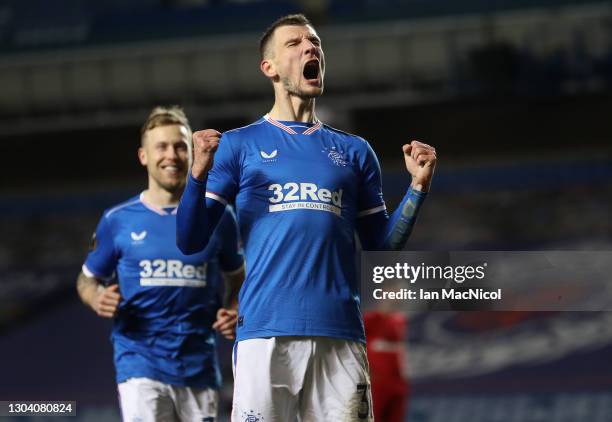 Borna Barisic of Rangers celebrates after scoring their team's fourth goal from the penalty spot during the UEFA Europa League Round of 32 match...