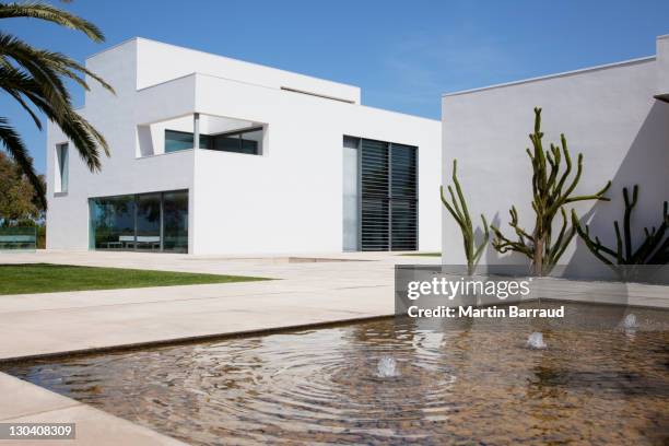 fountain in courtyard of modern house - spanish stock pictures, royalty-free photos & images