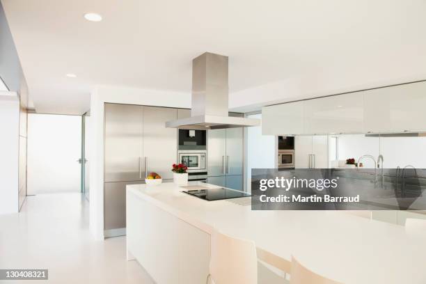 stove and counters in modern kitchen - design kitchen stock pictures, royalty-free photos & images