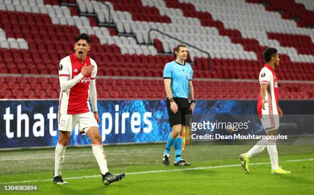 Ajax player David Neres celebrates with team mate Edson Alvarez after scoring the second Ajax goal as the assistant referee looks on during the UEFA...