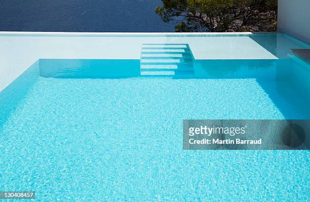 underwater steps in infinity pool - swimming pool stock pictures, royalty-free photos & images
