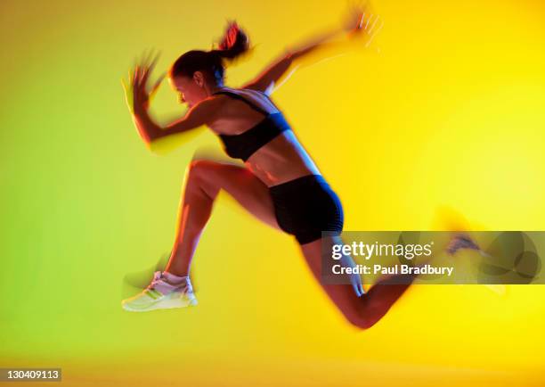 blurred view of athlete running - long jump stock pictures, royalty-free photos & images