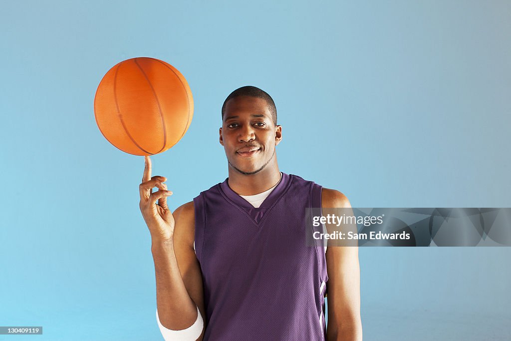 Basketball Player Balancing Ball On One Finger High-Res Stock Photo - Getty  Images