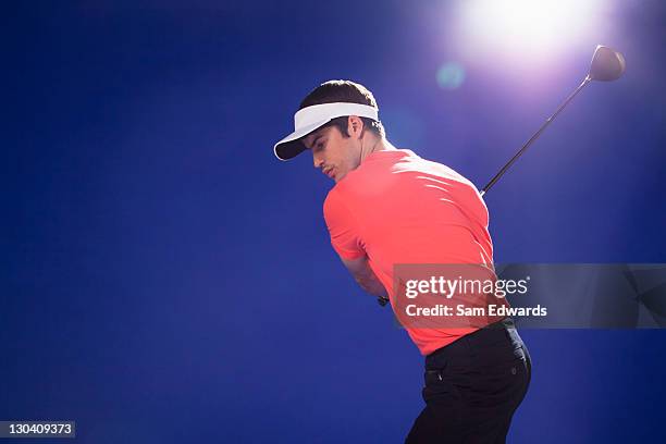 golf player swinging club - visor stock pictures, royalty-free photos & images