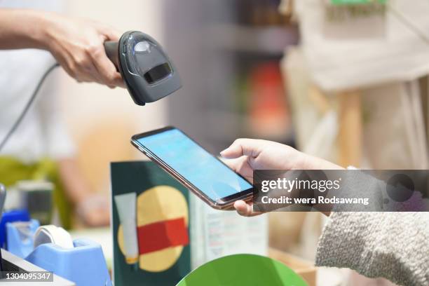 Scan To Buy Retail Store Scanning A Barcode From A Phone Screen Of Client High-Res ...