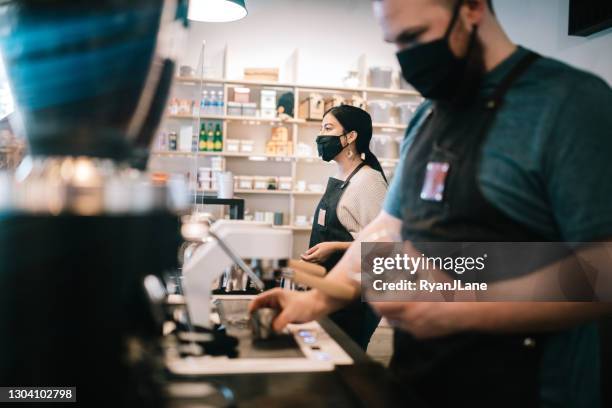 coffee shop small business owner at work during pandemic - small business mask stock pictures, royalty-free photos & images