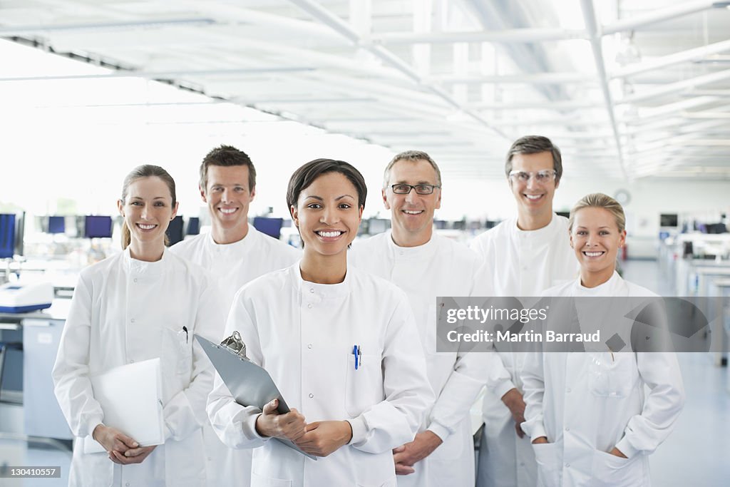 Scientists smiling together in lab