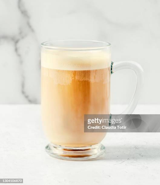 cup of chai latte on white background - milk tea cup stock pictures, royalty-free photos & images