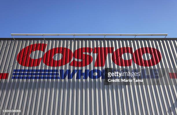The Costco logo is displayed at a Costco store on February 25, 2021 in Inglewood, California. Costco announced plans to increase its minimum wage to...