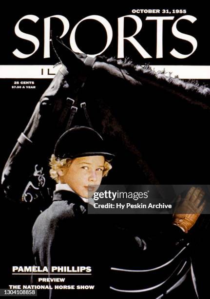 Pamela Phillips poses for a portrait as she prepares for the National Horse Show with gelding Burnable on September 1955 in Stamford, Connecticut. It...