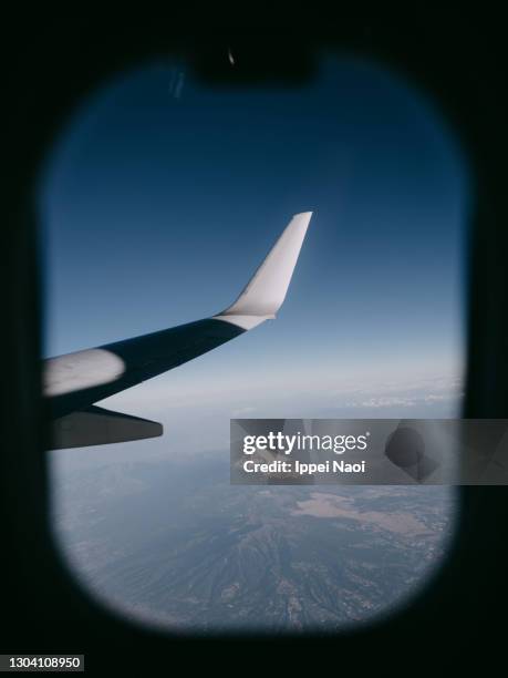 mt. fuji from aircraft window in winter, japan - mt fuji stockfoto's en -beelden