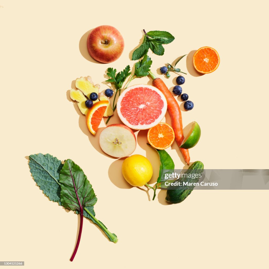 Fruit and vegetables on peach surface