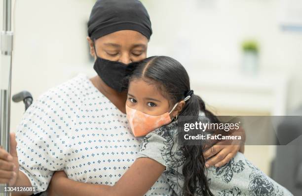 mother with cancer and her daughter stock photo - black bandana stock pictures, royalty-free photos & images