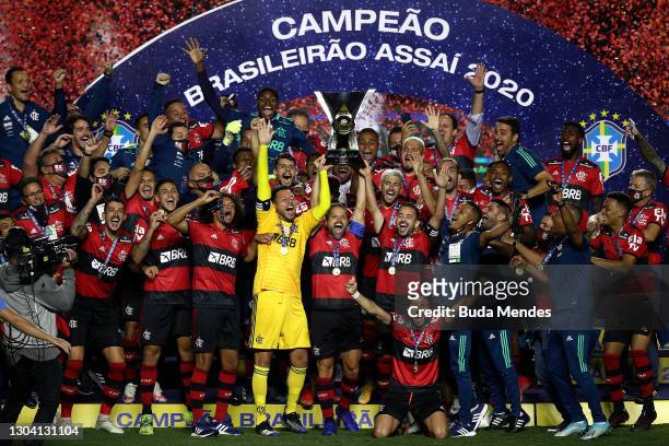 Goalkeeper Diego Alves and Diego of Flamengo lift the champions trophy after a match between Sao Paulo and Flamengo as part of 2020 Brasileirao...