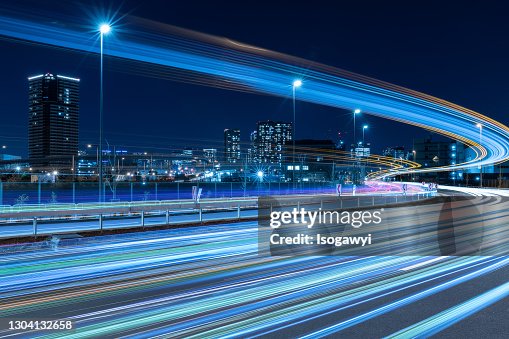 Urban Skyline And Light Trails Against Clear Sky At Night Urban Skyline And Light Trails Against Clear Sky At Night