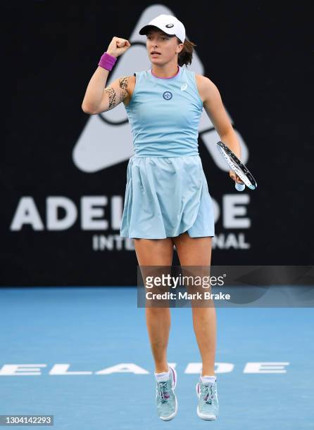 Iga Swiatek of Poland celebrates winning a game against Jil Teichmann of Switzerland during day five of the Adelaide International WTA 500 at...