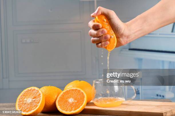 hand squeezed orange juice - juicing stock pictures, royalty-free photos & images