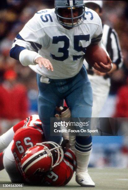 Running back Scott Laidlaw of the Dallas Cowboys runs through the tackle of Robert Pennywell of the Atlanta Falcons during the NFC Divisional Playoff...
