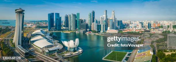 singapore aerial panorama over cbd skyscrapers landmarks and marina bay - artscience museum stock pictures, royalty-free photos & images