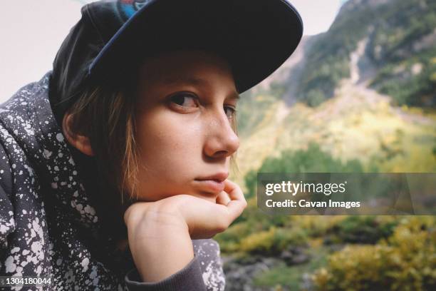 close up shot of kid on a hike looking bored. - mt dew stock pictures, royalty-free photos & images