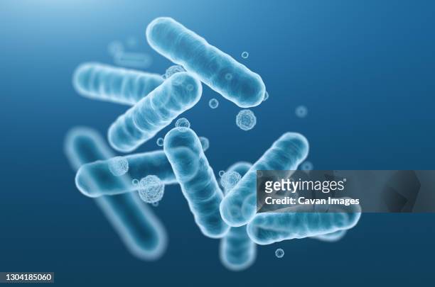 close-up of 3d rendering microscopic blue bacteria. - microorganismo fotografías e imágenes de stock