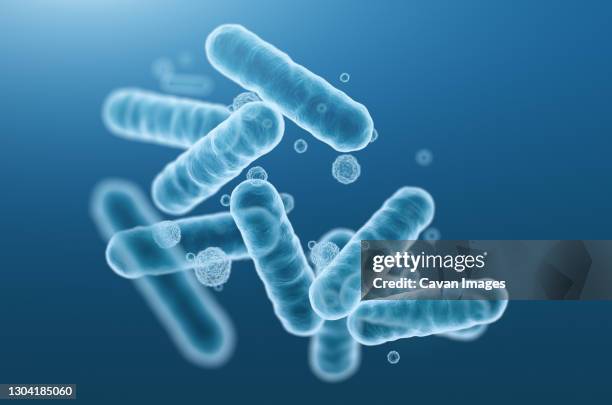 close-up of 3d rendering microscopic blue bacteria. - salmonella bacterium stock pictures, royalty-free photos & images