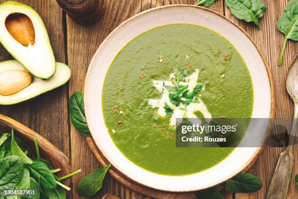spinach soup with cream in a bowl. - cream soup stock pictures, royalty-free photos & images