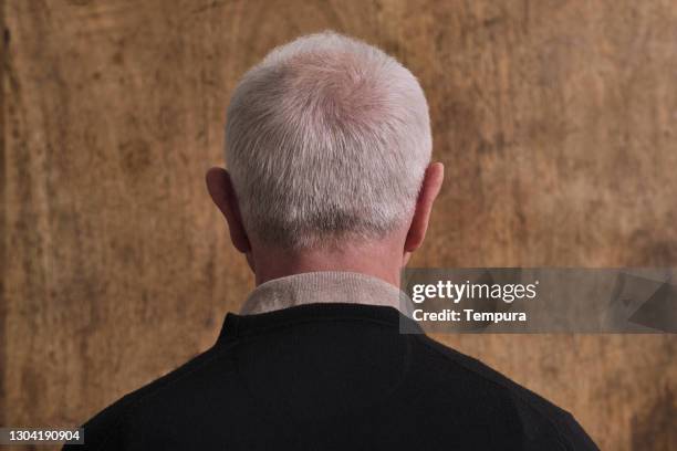 one senior man's back view. - man rear view grey hair closeup stock pictures, royalty-free photos & images