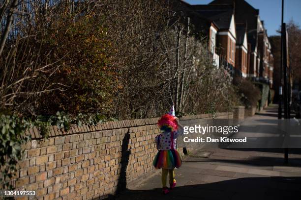 Children in fancy dress walk through Stamford Hill during Purim, on February 26, 2021 in London, England. Purim is usually celebrated by Jewish...