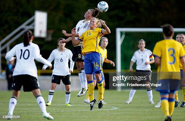 Melanie Leupolz of Germany and Julia Karlenaes of Sweden battle for the ball during the U19 Women's International friendly match between Germany and...